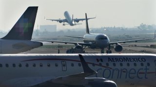 FILE - An AeroMexico plane taxis on the tarmac of the Benito Juarez International Airport,