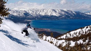 FILE — A skier kicks up some powder at Heavenly Ski Resort,