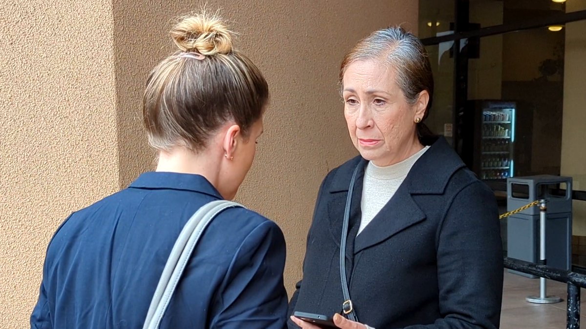 Carla White (right), talkes to her attorney Lauren Angeles (left) outside the El Cajon courthouse.