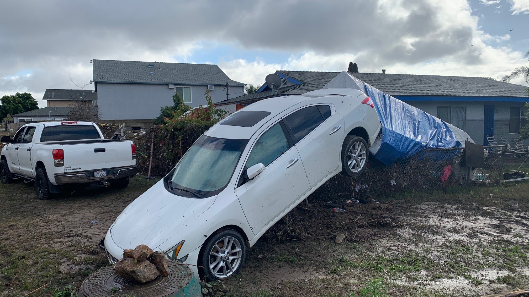 A car in Southrest on Jan. 22, 2024, that was tossed around in floodwaters during a powerful storm.