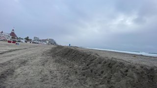 City crews have been building walls of sand, or "beach berms" to combat further coastal erosion on Coronado's beaches. (NBC 7)