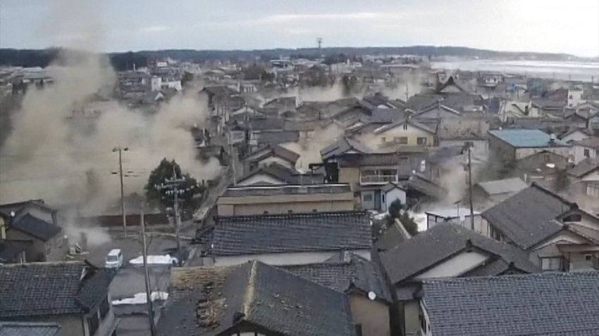 Dust rises from houses during strong earthquake in Japan