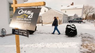 A real estate agent walks into a home for sale in Lancaster, Ohio.