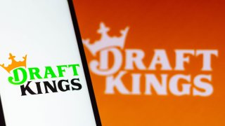 In this photo illustration the DraftKings logo seen displayed on a smartphone.