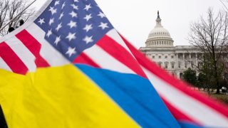 Ukraine sympathizers fly a Ukrainian flag outside as the Senate works through the weekend on a $95.3 billion foreign aid bill with assistance for Ukraine and Israel at the U.S. Capitol on February 11, 2024 in Washington, DC. 