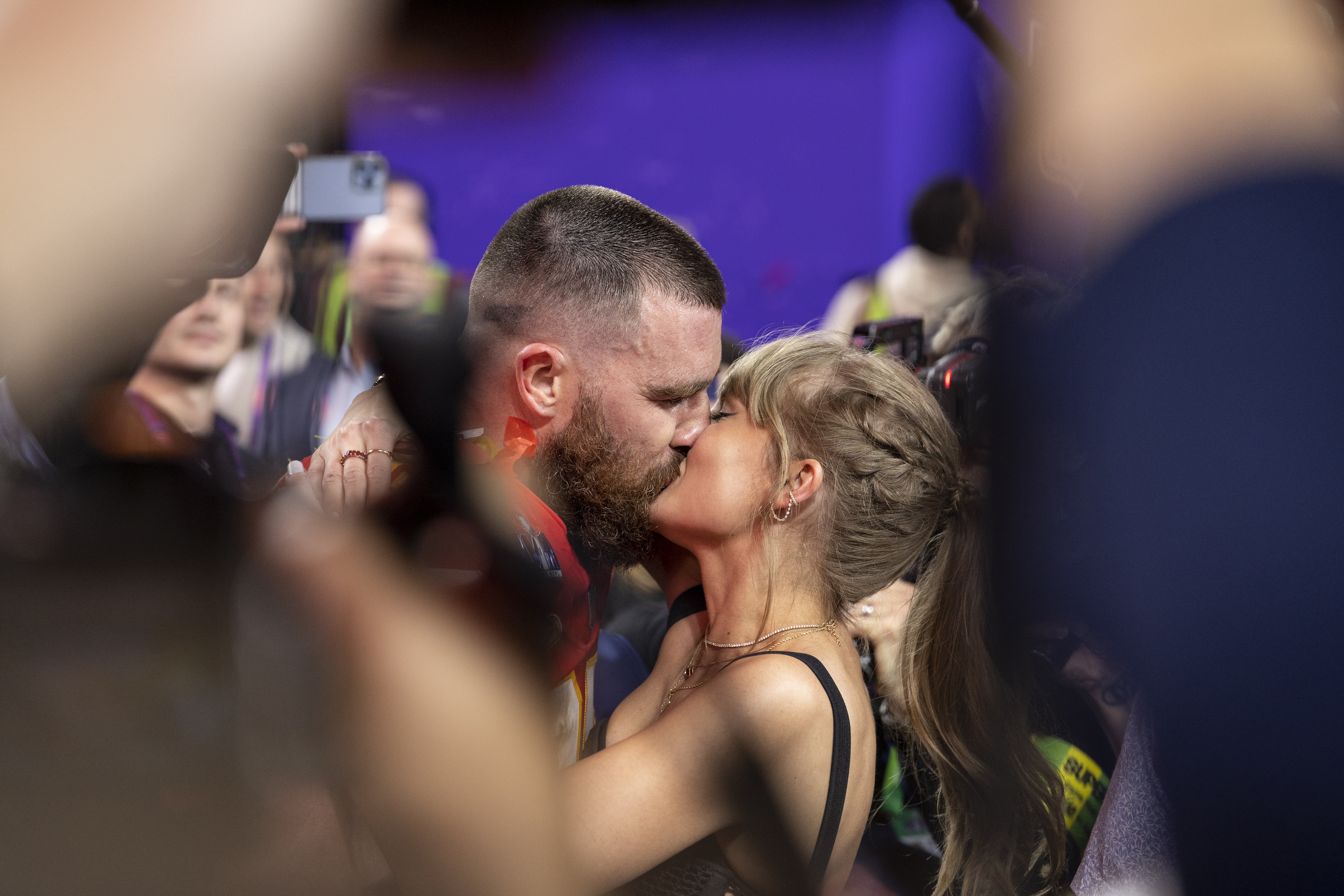 Travis Kelce #87 of the Kansas City Chiefs celebrates and kisses Singer Taylor Swift following the NFL Super Bowl 58 football game.
