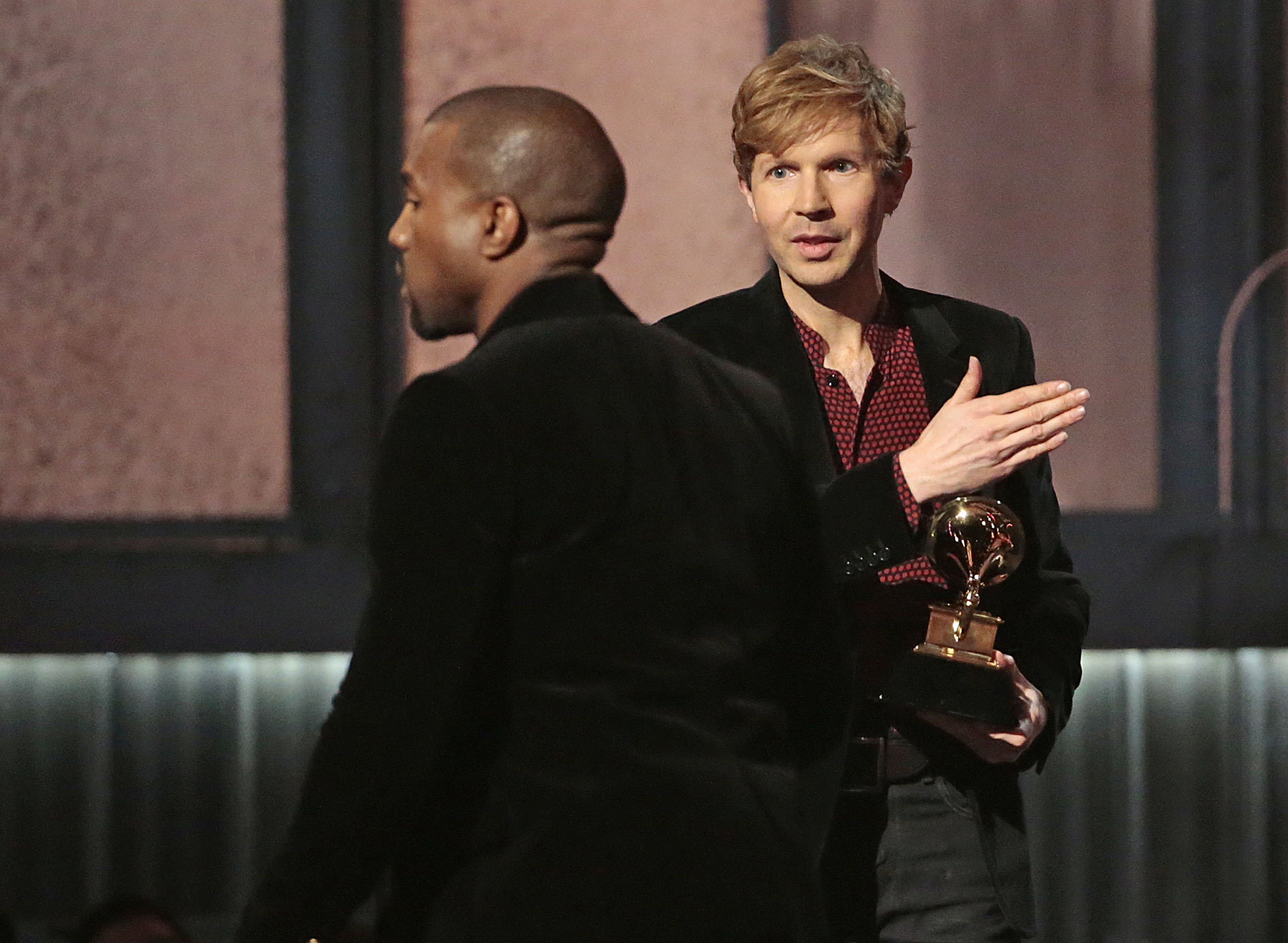 LOS ANGELES, CA - February 8, 2015 Kanye West avoids contact with an inviting Beck after Beck won Al