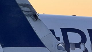 A JetBlue plane's winglet received damage after making contact with another