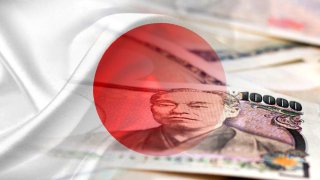 An editorial montage of the Japan flag and Japanese yen cash bank notes