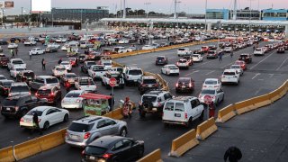 Vehicles travel across the San Ysidro Port of Entry in Tijuana, Mexico, on Feb. 7, 2022.