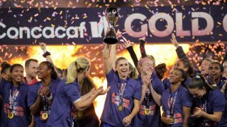 Alex Morgan #7 of the United States hoisting the trophy and celebrating with her USA teammates during the 2024 Concacaf W Gold Cup Final game between Brazil and USWNT at Snapdragon Stadium on March 10, 2024 in San Diego, California.