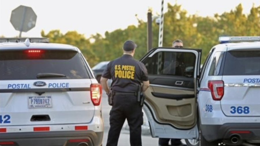 This undated photo shows a postal police officer during an investigation.