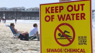 A sign warning of a sewage spill in Pacific Beach.