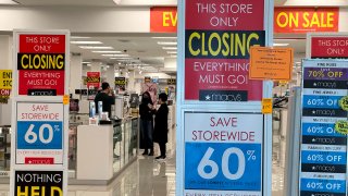 Signs are posted at the entrance to a Macy’s store that is set to close at Bay Fair Mall on February 27, 2024 in San Leandro, California. Macy’s announced plans to shutter 150 underperforming stores across the United States. 