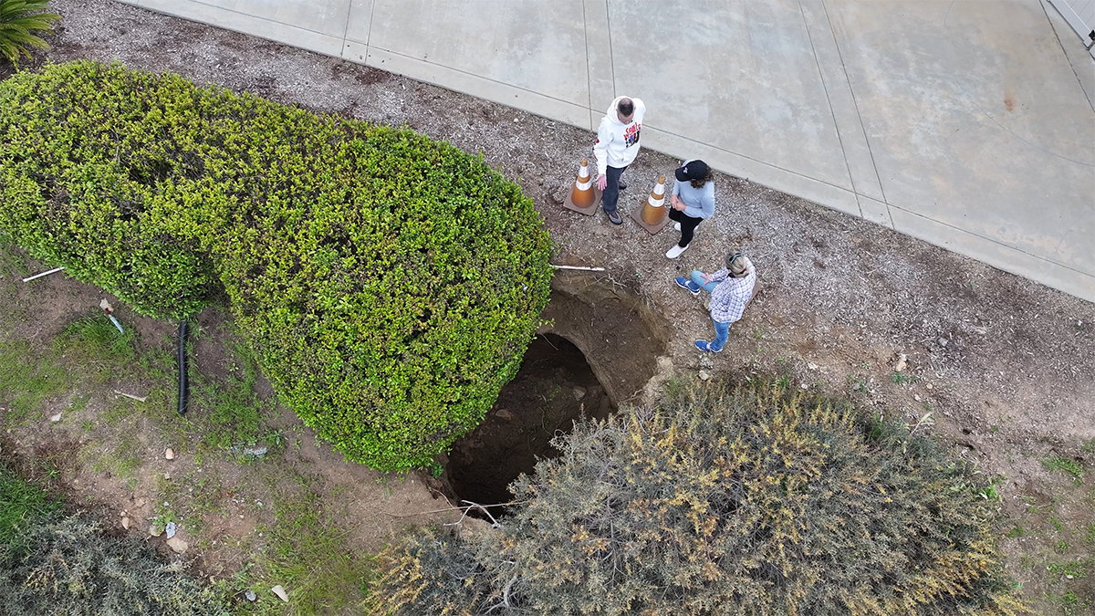 Earlier this year, a second sinkhole opened up close the family's garage.