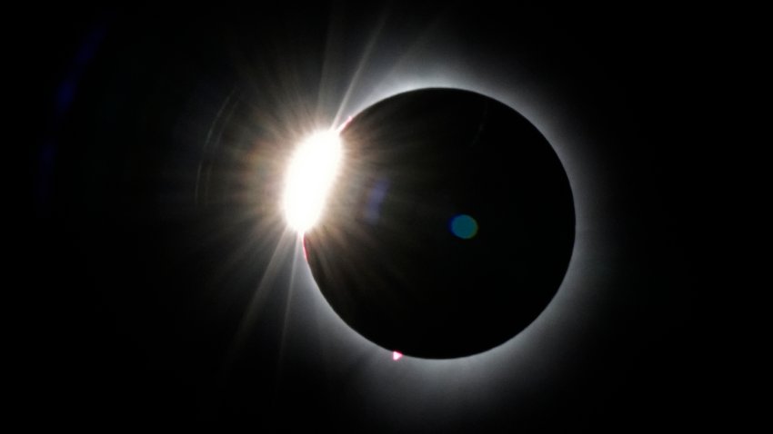 The moon covers most of the the sun as it approaches the total solar eclipse, as seen from the summit of Saddleback Mountain, Monday, April 8, 2024, near Rangeley, Maine.