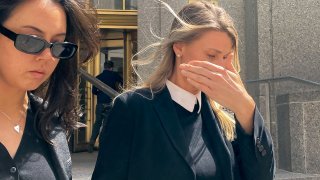 Aimee Harris, right, walks out of Manhattan federal court, Tuesday, April 9, 2024, in New York.