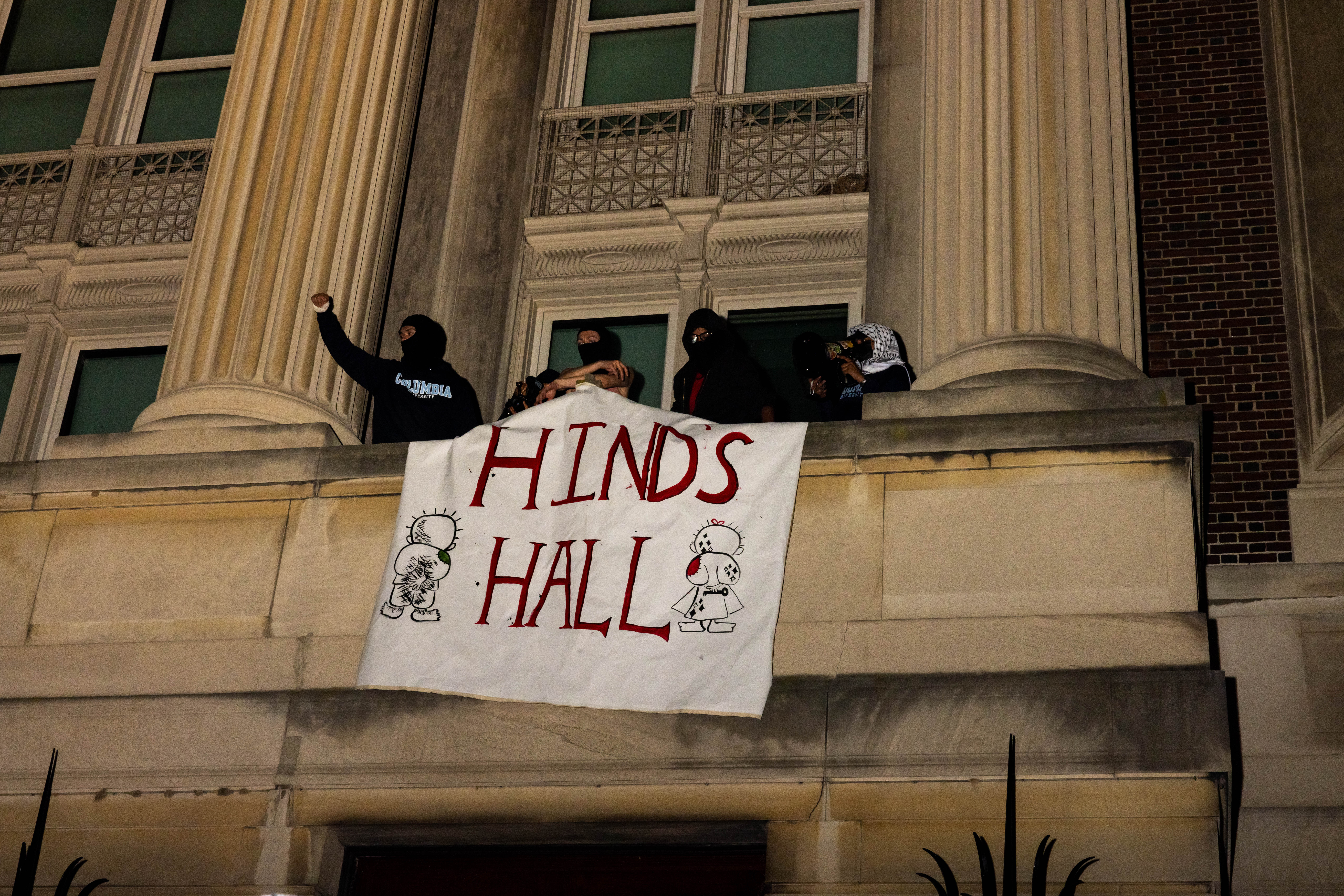 Columbia University pro-Palestine demonstrators barricade themselves inside Hamilton Hall, an academic building that has been occupied in past student movements, on Tuesday, April 30, 2024. The banner reads the name of a Palestinian child allegedly killed by the Israeli military.