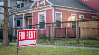 A “For Rent” sign is posted near a home in Houston, Texas, on Feb. 7, 2022.