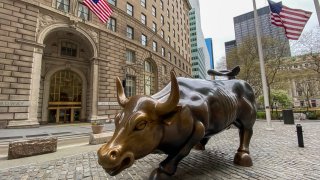 The Charging Bull is seen on an empty Wall Street on April 20, 2020 in New York City. 