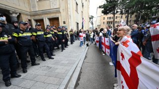 Demonstrators protesting the “foreign influence” law crowd outside the parliament building in central Tbilisi on May 28, 2024.