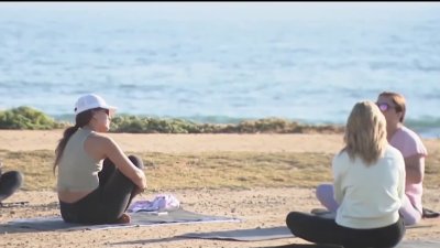 Future of beach yoga classes uncertain due to issues with city permits