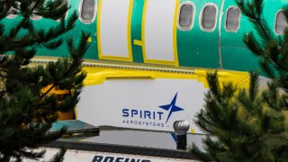 Spirit AeroSystems Holdings Inc. signage near a Boeing 737 Max 8 aircraft fuselage outside the Boeing Co. manufacturing facility in Renton, Washington, US, on Sunday, Jan. 7, 2024.