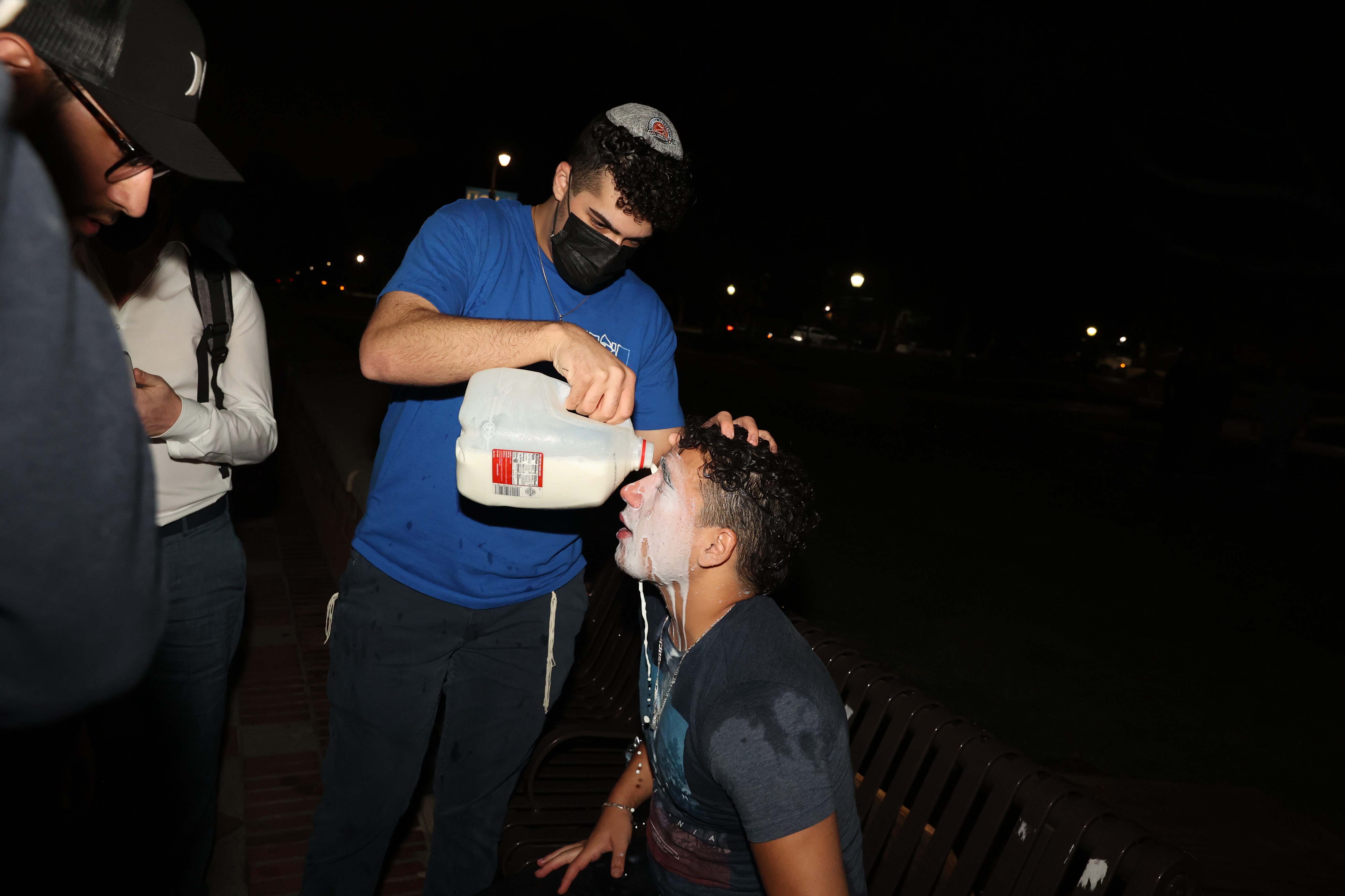 Los Angeles, CA – April 30: A Pro-Israel group member has milk put on his face after being either pepper sprayed or tear gassed from the pro-Palestine group at UCLA on Tuesday, April 30, 2024 in Los Angeles, CA. (Michael Blackshire / Los Angeles Times via Getty Images)