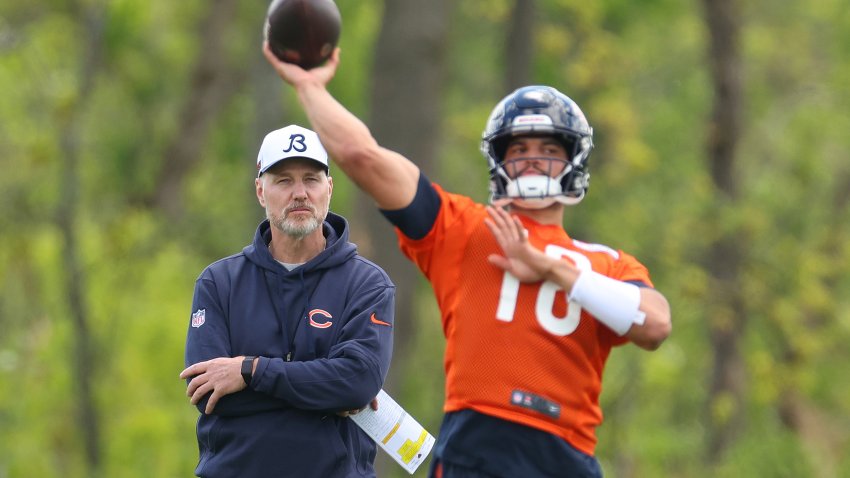 LAKE FOREST, ILLINOIS – MAY 11: Head coach Matt Eberflus of the Chicago Bears watches as Caleb Williams #18 throws a passing drill during Chicago Bears Rookie Minicamp at Halas Hall on May 11, 2024 in Lake Forest, Illinois.  (Photo by Michael Reaves/Getty Images)