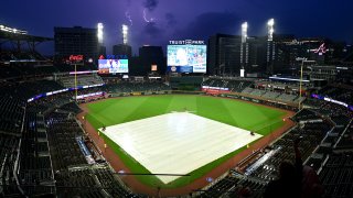 ATLANTA, GA – MAY 18th: Lightning strikes during a weather delay prior to the game between the San Diego Padres and the Atlanta Braves at Truist Park on on May 18th, 2024 in Atlanta, Georgia. (Photo by Adam Hagy/Getty Images)