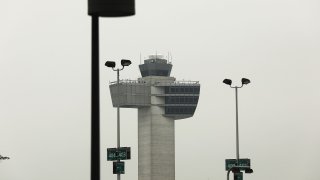 File - An air traffic control tower at John F. Kennedy International Airport (JFK).