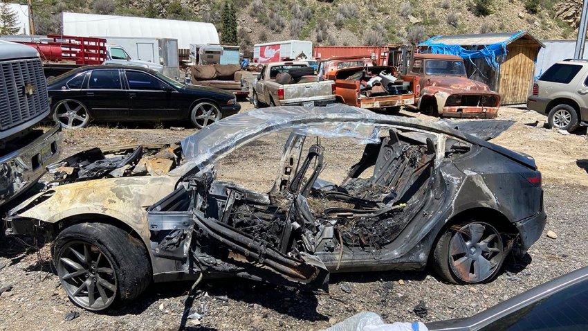 This image provided by Colorado State Patrol shows a Tesla Model 3 that crashed on May 16, 2022, in Clear Creek County, Colo.