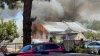 Flames burn through Carlsbad home, roads closed