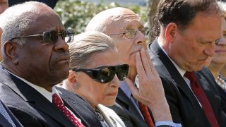 (L-R) U.S. Supreme Court Chief Justices Clarence Thomas, Ruth Bader Ginsburg, Stephen Breyer, and Samuel Alito attend Judge Neil Gorsuch’s judicial oath ceremony in the Rose Garden at the White House April 10, 2017 in Washington, DC.