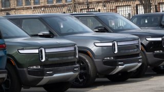 Rivian electric vehicles sit in a lot at a Rivian facility in February 22, 2024 in Chicago, Illinois.