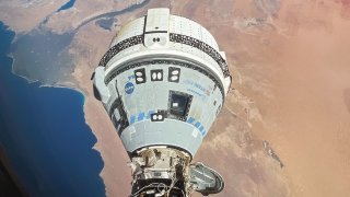 Boeing’s Starliner spacecraft is pictured docked to the International Space Station orbiting above Egypt’s Mediterranean coast on June 13, 2024.