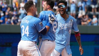 KANSAS CITY, MISSOURI – JUNE 02: Nick Loftin #12 of the Kansas City Royals is congratulated by Freddy Fermin #34 and Maikel Garcia #11 after hitting a sacrifice fly to win a game against the San Diego Padres  at Kauffman Stadium on June 02, 2024 in Kansas City, Missouri. The Royals won 4-3. (Photo by Ed Zurga/Getty Images)