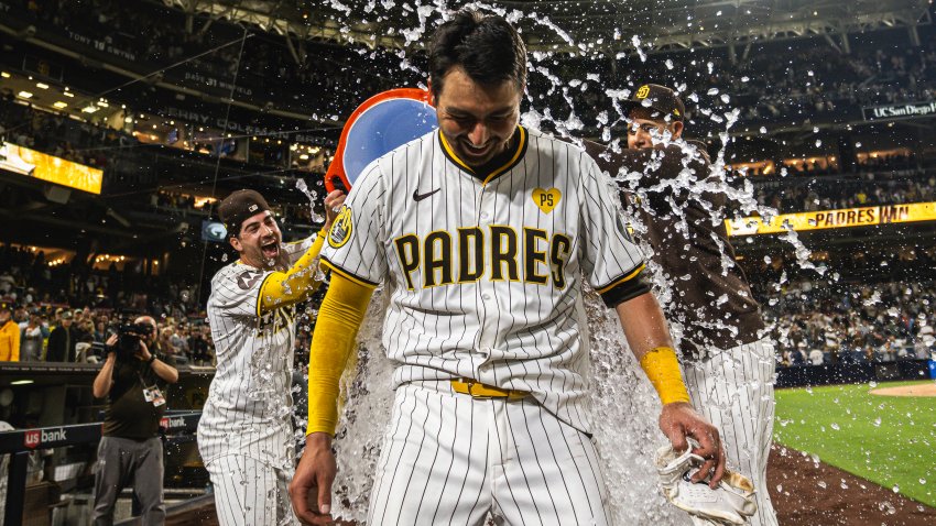 SAN DIEGO, CALIFORNIA – JUNE 11: Kyle Higashioka #20 of the San Diego Padres is doused after hitting a walk-off home run in the ninth inning against the Oakland Athletics at Petco Park on June 11, 2024 in San Diego, California. (Photo by Matt Thomas/San Diego Padres/Getty Images)