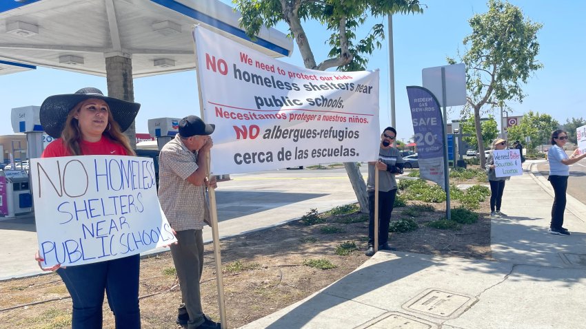 Protesters took to the streets of Spring Valley on June 1, 2024, to call on the San Diego County Board of Supervisors to halt a project that would build 150 sleeping cabins in a vacant lot. (NBC 7 San Diego)