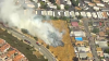 Firefighters battling vegetation fire near homes in Spring Valley