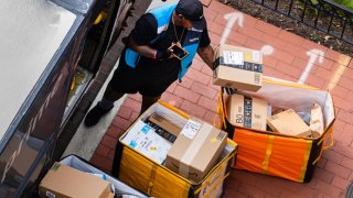 An Amazon driver delivers packages in Washington, D.C., on Aug. 27, 2023.