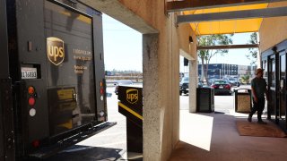 A person walks into a UPS (United Parcel Service) customer center on April 1, 2024 in Los Angeles, California. 