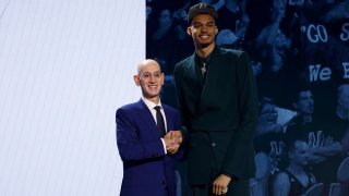 Victor Wembanyama poses with NBA commissioner Adam Silver after being drafted first overall by the San Antonio Spurs during the first round of the 2023 NBA Draft.