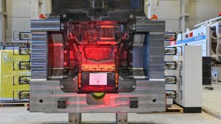 A die-casting tool for the production of metal parts for a Tesla Model Y is seen at a production hall of the Tesla Gigafactory during the open day. In Grünheide, east of Berlin, the first vehicles are due to roll off the production line from the end of 2021. 