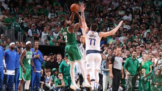 Jaylen Brown, #7 of the Boston Celtics, shoots a three-point basket against the Dallas Mavericks during Game 5 of the 2024 NBA Finals at TD Garden in Boston on June 17, 2024.