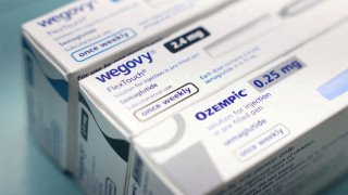 Boxes of Ozempic and Wegovy made by Novo Nordisk are seen at a pharmacy.