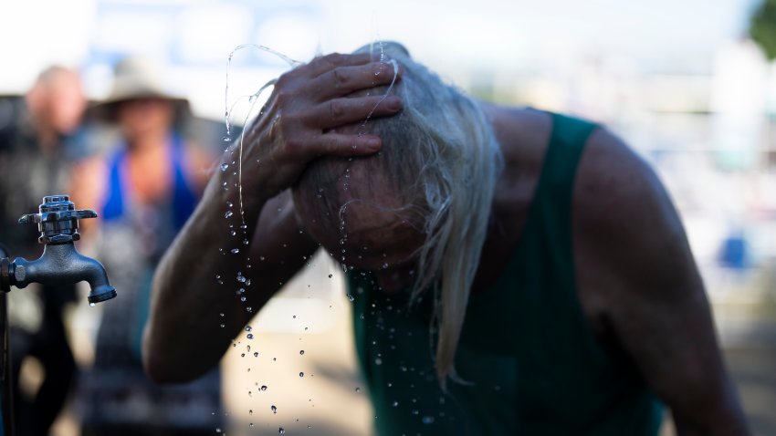 A slow-moving and potentially record-setting heat wave is spreading across the Western U.S., sending many residents in search of a cool haven from the dangerously high temperatures.