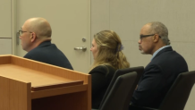 Parrish Chambers Jr. (right) sits with members of his defense team during his murder trial.