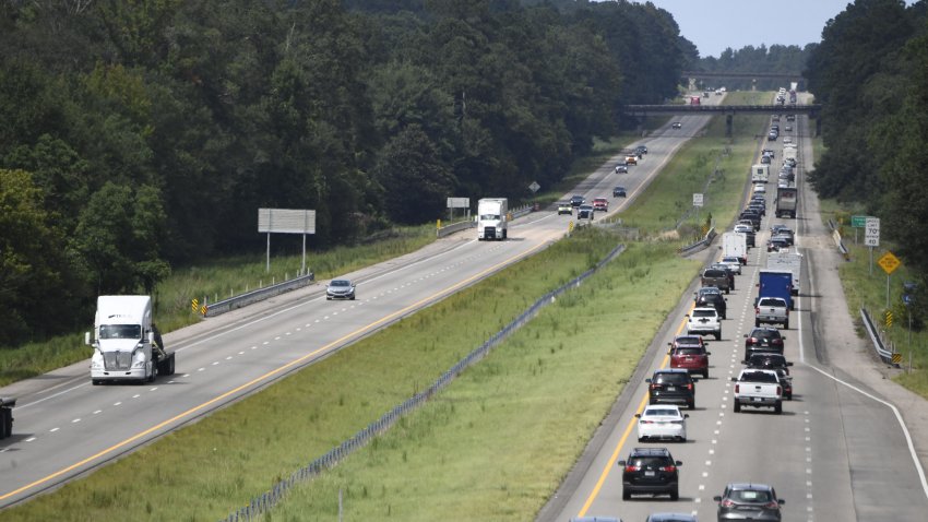 FILE: People drive on Interstate Highway 55 near Magnolia, Mississippi, as they drive away from New Orleans on August 28, 2021.