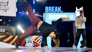 Logan Edra (L) of US, also known as B-Girl Logistx competes in the women's Breaking B-Girls semi-final during the Olympic Qualifier Series for breaking, BMX freestyle, skateboarding, and sport climbing events ahead of the Paris 2024 Olympic and Paralympic Games, in Shanghai on May 19, 2024. 